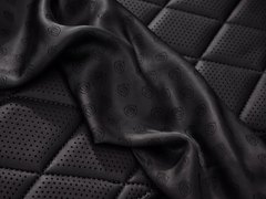 Black cloth with the LuxLimo logo on quilted black leather